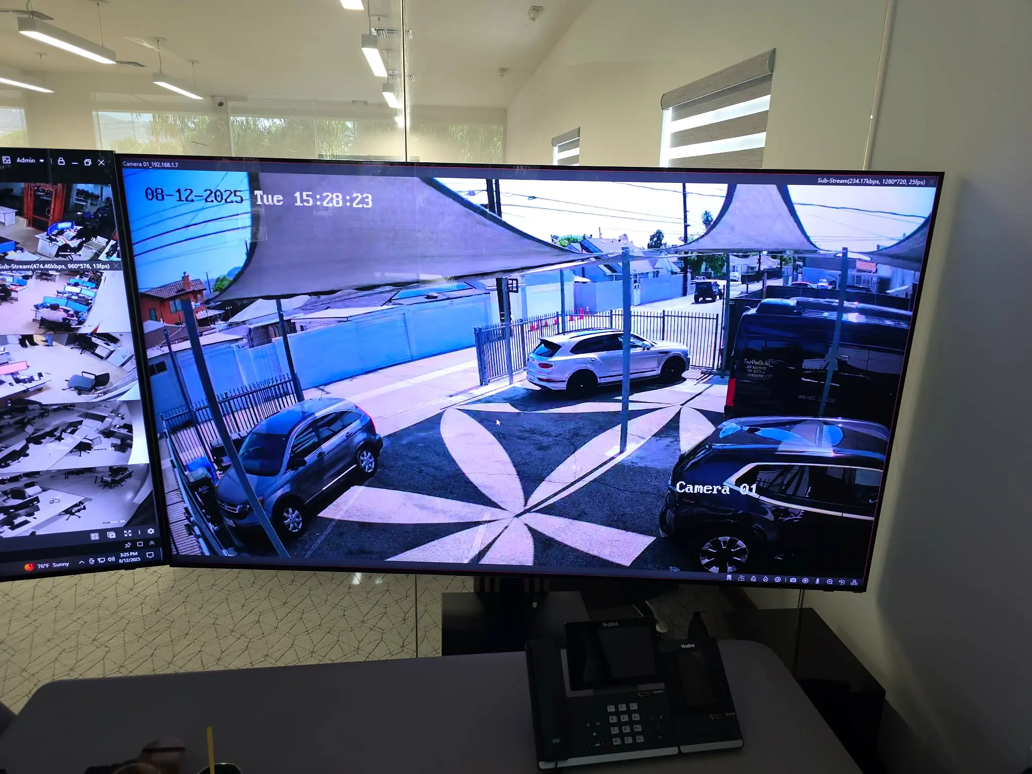 Large display showing live exterior security camera coverage at the Bel Air property