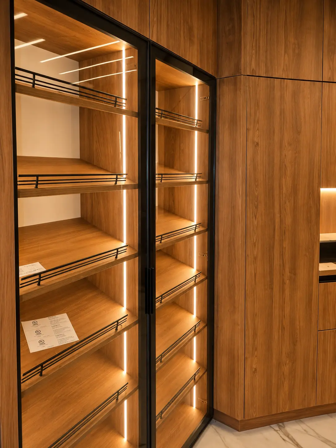 Walk-in closet with vertical LED shelf lighting
