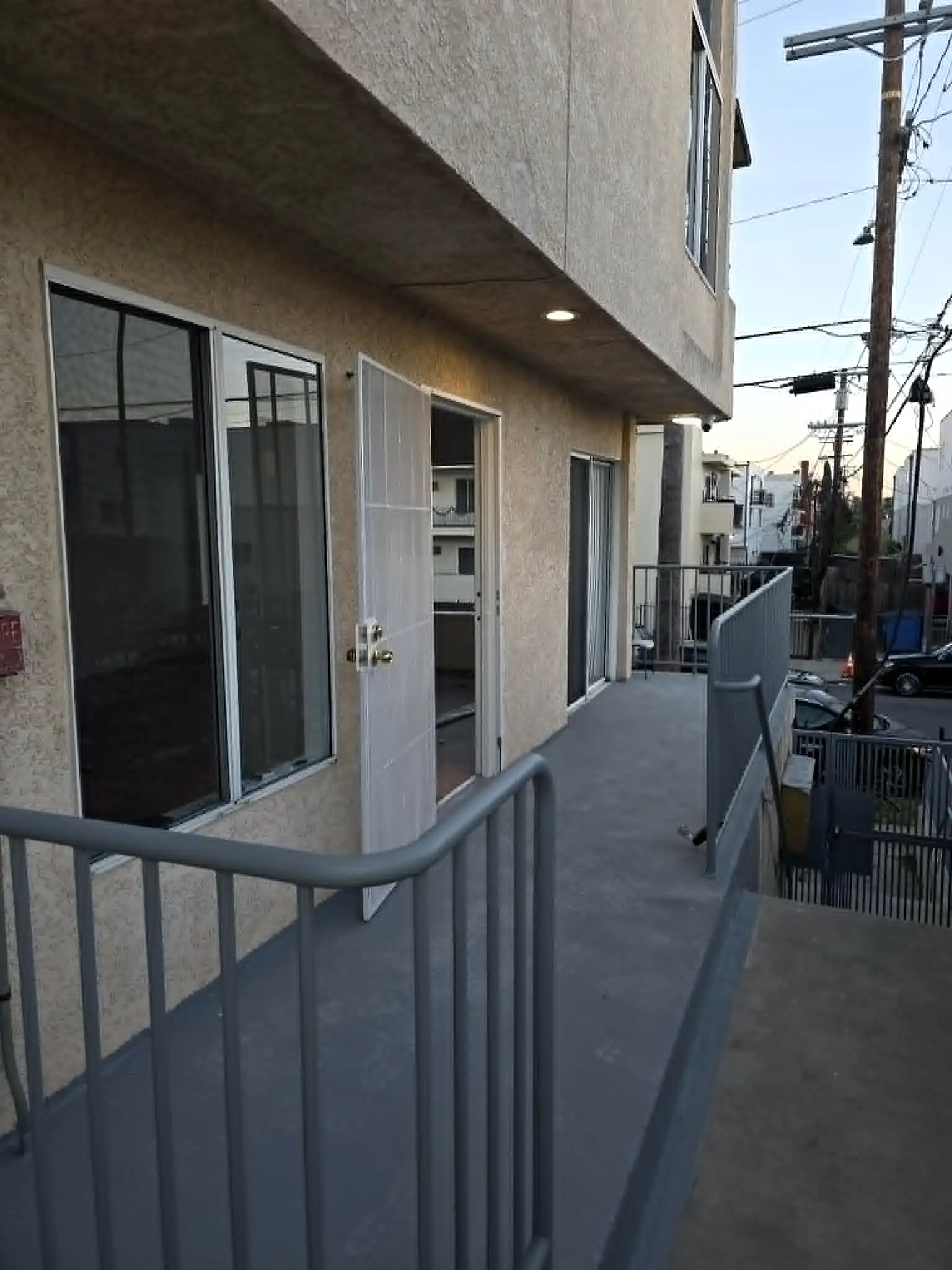 Security camera installed above an exterior apartment walkway in Hollywood