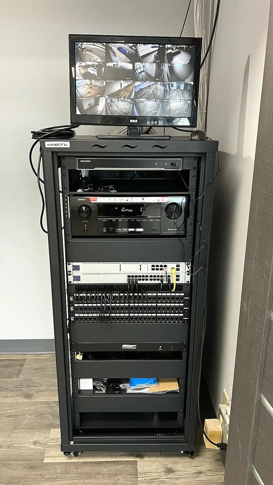 Integrated rack with network, audio and surveillance equipment
