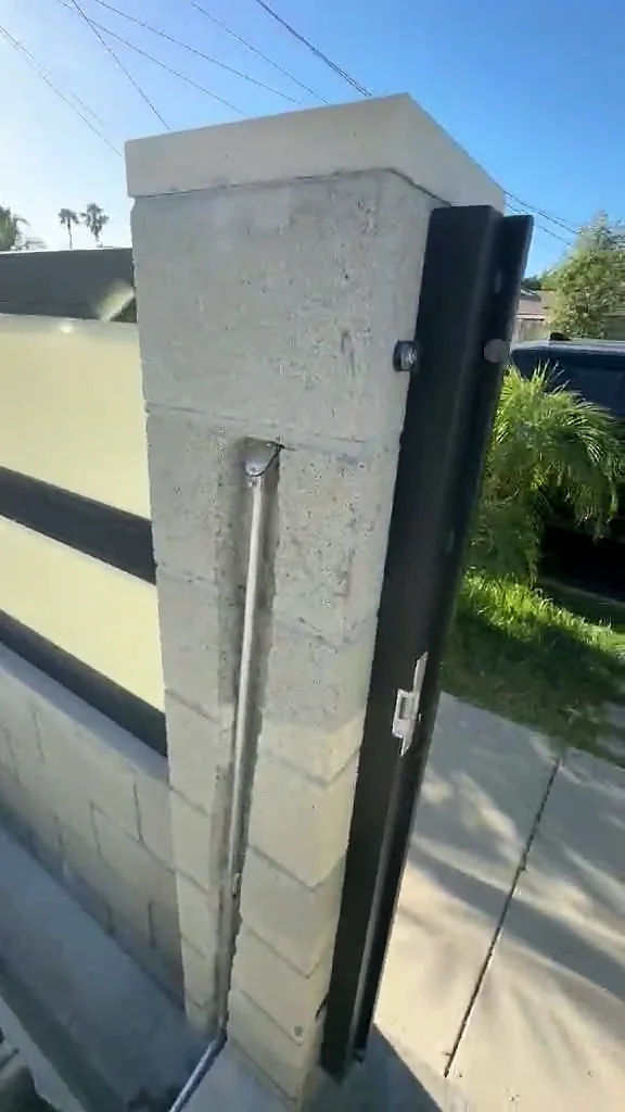 Protected exterior conduit routed beside the childcare center gate