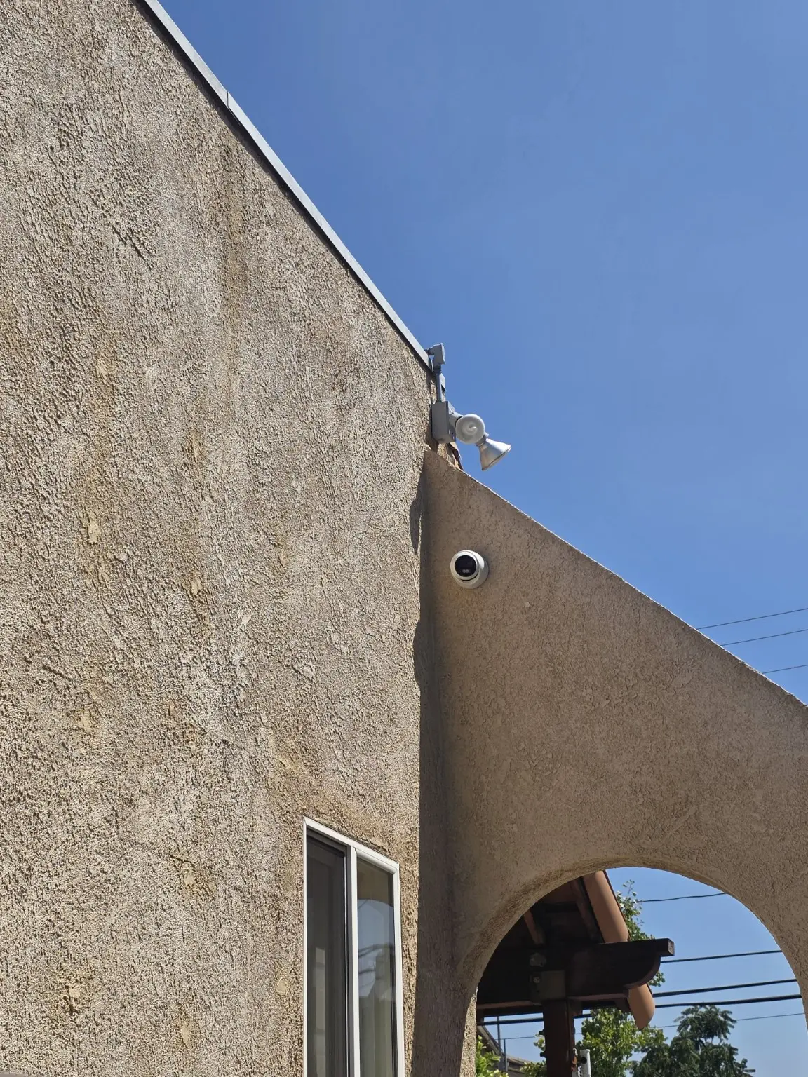 Two exterior security cameras covering the corner of a Pasadena building