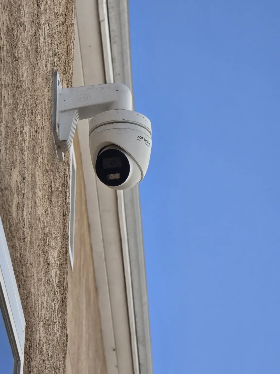 Close view of an exterior turret security camera installed in Pasadena