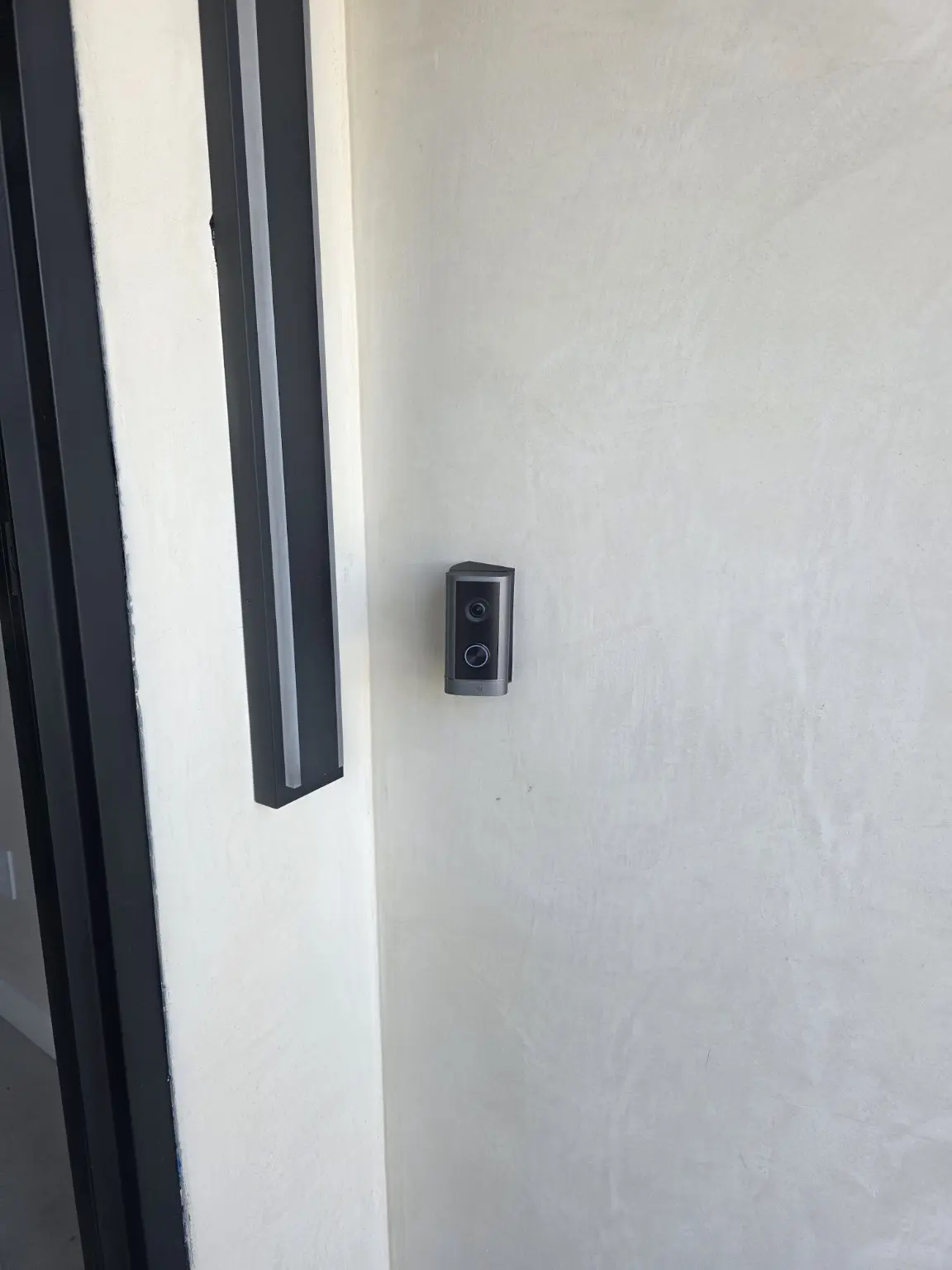 Video doorbell installed beside the front door of a Studio City home
