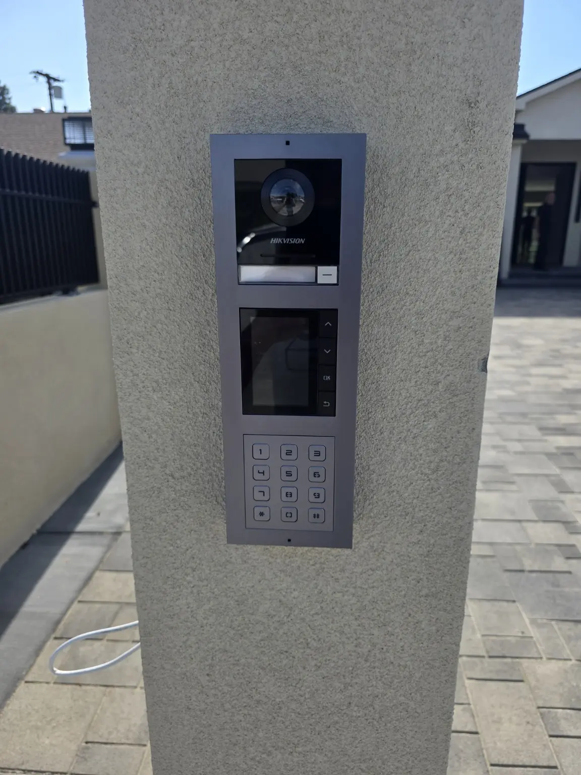 Video intercom with keypad installed at a residential gate in Studio City