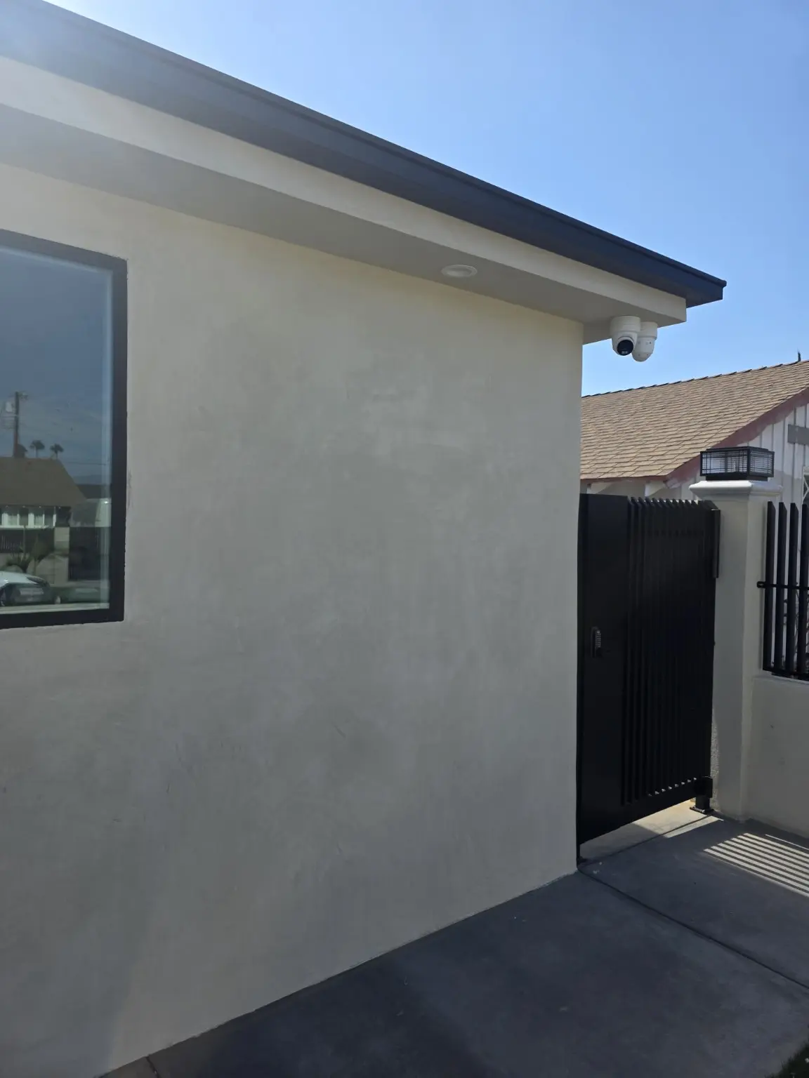Camera overlooking a residential entry gate, installed by NEM Technology