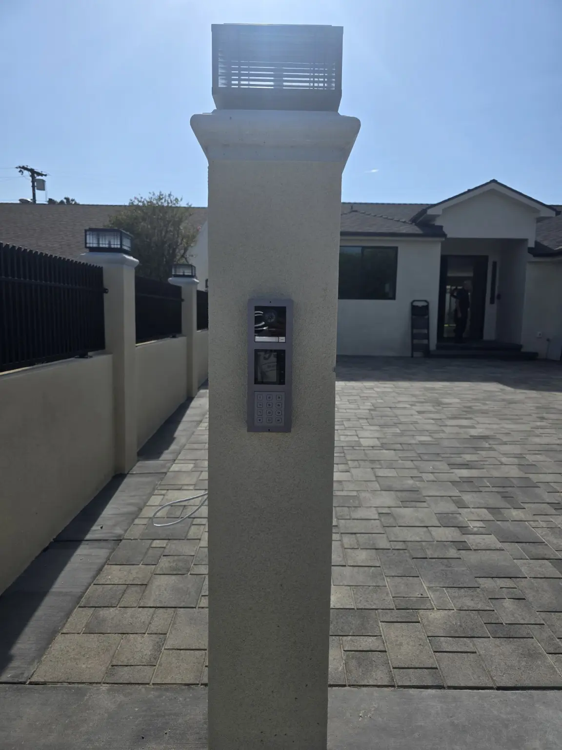 Video intercom mounted on the entrance pillar of a Studio City residence